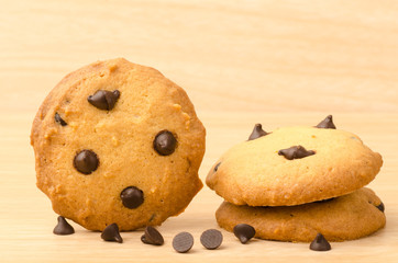 Chocolate chip cookies on wooden background