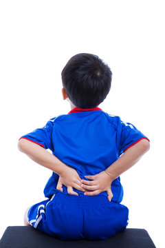 Back Pain. Child Rubbing The Muscles Of His Lower Back