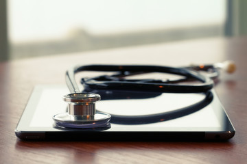 Studio macro of a stethoscope and digital tablet with shallow DO