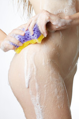 Fototapeta premium Woman in bathroom with wisp of bast