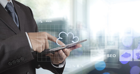 Double exposure of businessman shows modern technology as concep