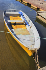 the boat with oars is moored