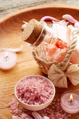 Spa still life with pink sea salt and flower petals