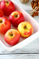 Red apples in a white bowl