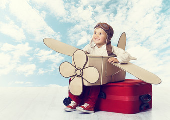Little Child Playing Airplane Pilot, Kid on Travel Suitcase
