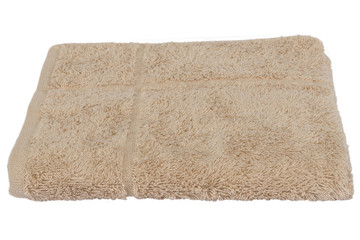 Fototapeta na wymiar Folded bath towel on white isolated background