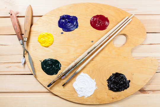 Palette with oil paint and palette knife.