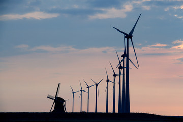 Windmills in front of evening sky - 79937277