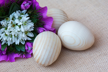 Snowdrop flowers and wooden eggs
