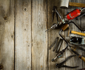 Various tools on a wooden background.