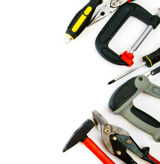 Many working tools - clamp, hammer and others on white