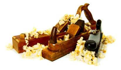 Joiner's works. Wooden shaving and plane on white background