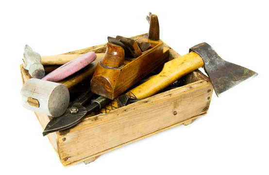 Working tools (axe, chisel, plane and others) in an old box on