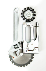Metalwork. Saw, spanner and others tools on white background.