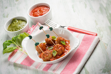 pesto meatballs with tomato sauce