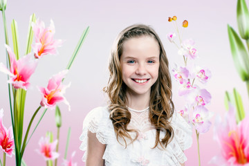 Obraz na płótnie Canvas Young girl in flower garden .