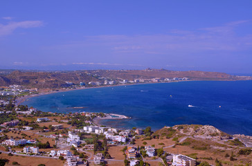 The city and the beach on the bay on the island of Rhodes.