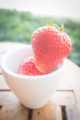 Fresh ripe strawberries on wooden background