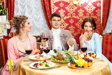 company in the vintage clothing have fun in  restaurant