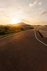 Fototapeta premium Road and bridge during sunset