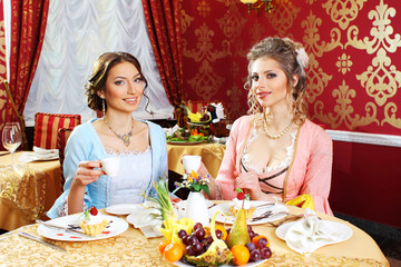 Girls in vintage dresses in the restaurant.  