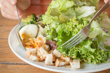 Homemade salad serving on wooden table
