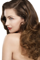 Beautiful model showing healthy brown wavy hair