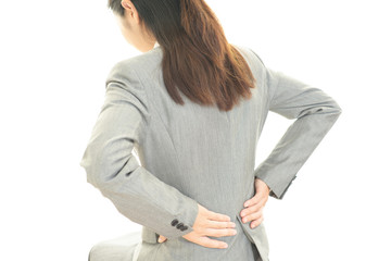 腰痛を訴える女性