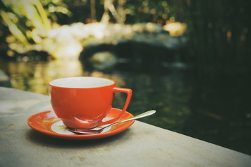 cup of coffee on the wood texture