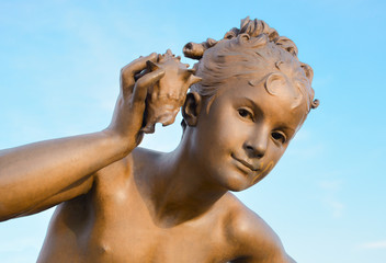 Girl with shell, detail from Pont Alexandre III, Paris.