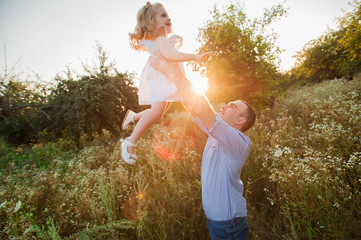 Healthy Father and Daughter Playing Together at Sunset.