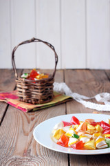 Plate and basket with colorful sweet candies