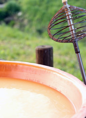 Iron tool for stirring the milk in copper pot for making cheese