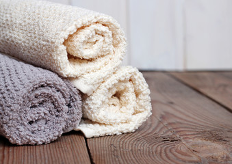 Fototapeta na wymiar Rolls of pure towels on a wooden