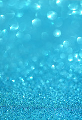Abstract blurred photo of blue bokeh light burst and textures
