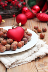 Christmas hearth with nuts on a white plate