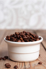 White bowl with coffee beans