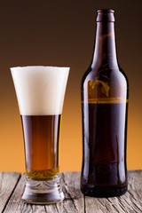 Beer bottle with a glass and spica