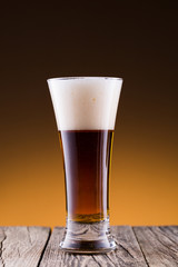 Beer bottle with a glass and spica