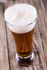 Beer bottle with a glass and spica