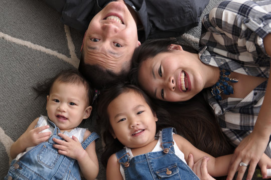 Asian family smiling and laughing