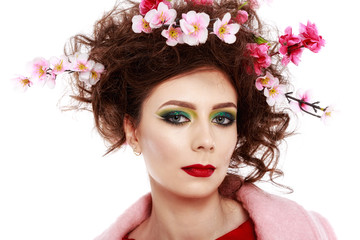 Naklejka premium Portrait of a beautiful spring girl wearing flowers in hair. Stu