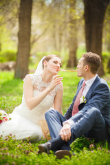 Bride feeds the groom