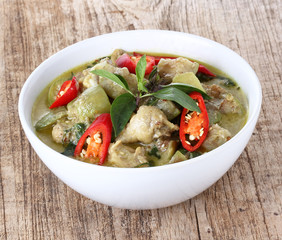 Green sweet pork Curry , Thai cuisine on wood