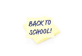 Yellow sticky note on block with text Back To School