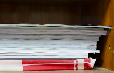 pile of documents on the desk