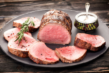 Roast beef with salt, pepper and rosemary