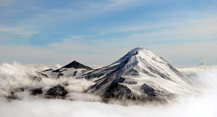 peaks of mountains above the clouds, Russia, Kamchatka