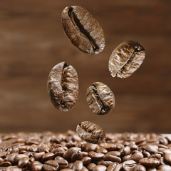 Coffee beans on brown background