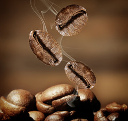 Coffee beans on brown background